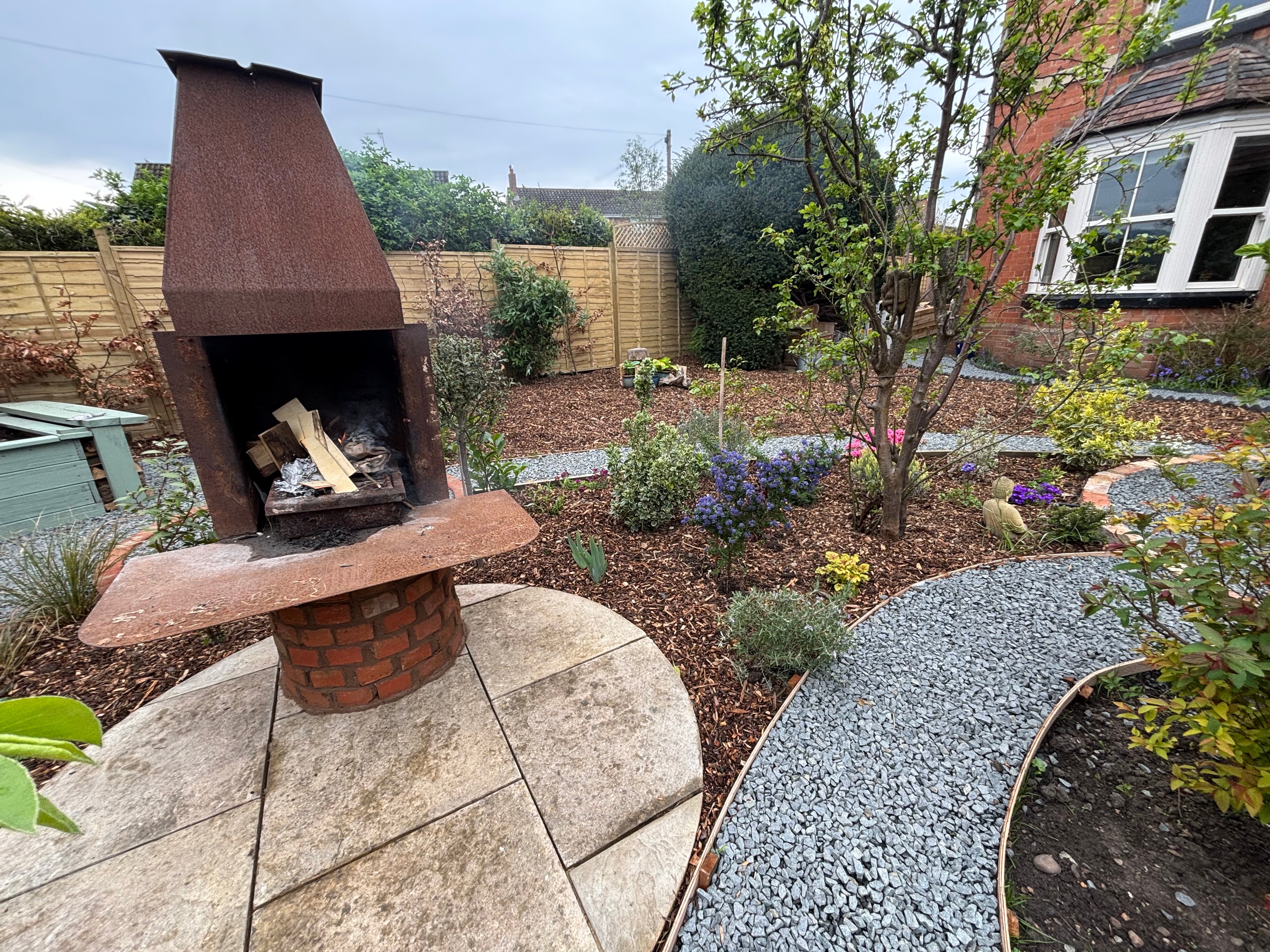 Garden transformation with outdoor fireplace